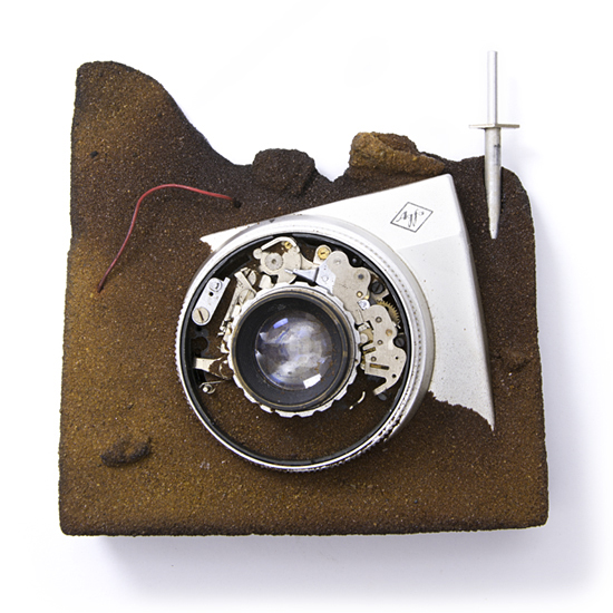 In honor of war correspondents, 2015, camera, sand, &c., mixed media, 100 x 100 mm