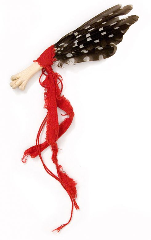 Cultic proto-money, 2003., bone, feather, textile &c., mixed media, 300 x 100 mm