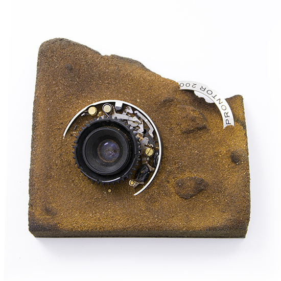 Hommage à Robert Capa, 2015., camera, sand, &c., mixed media, 140 x 140 mm